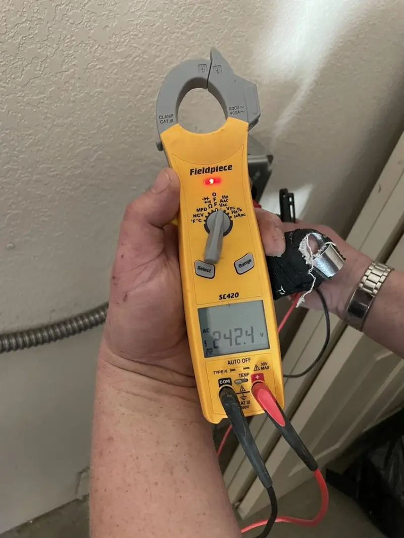 Voltage testing with clamp meter during Generator Installation in Lake Cassidy